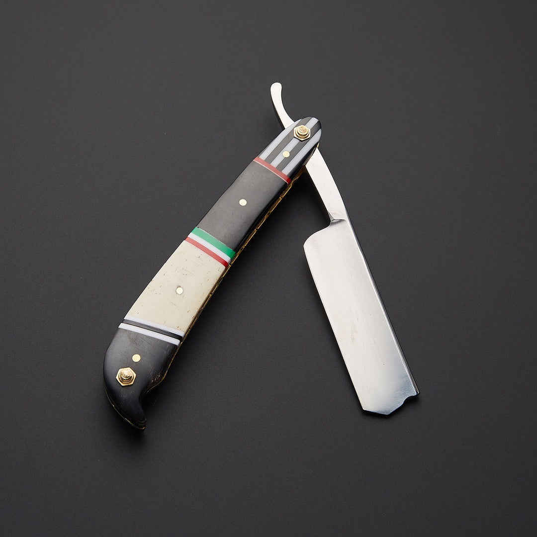 Close-up of J2 steel straight razor blade showing clean polished surface and sharp cutting edge for smooth and precise shaving.