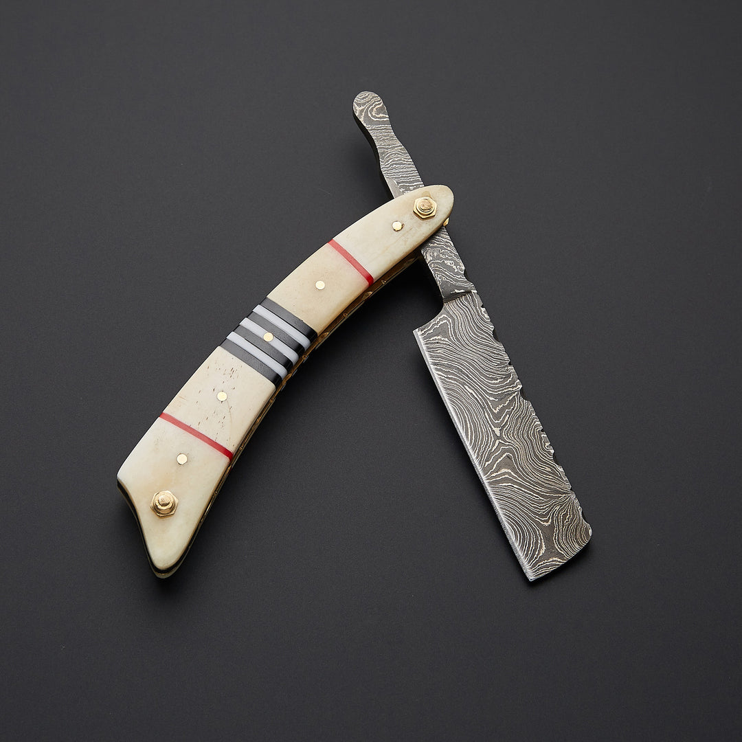 Luxury cut throat straight razor crafted from Damascus steel displayed with handmade leather sheath for safe storage and grooming.