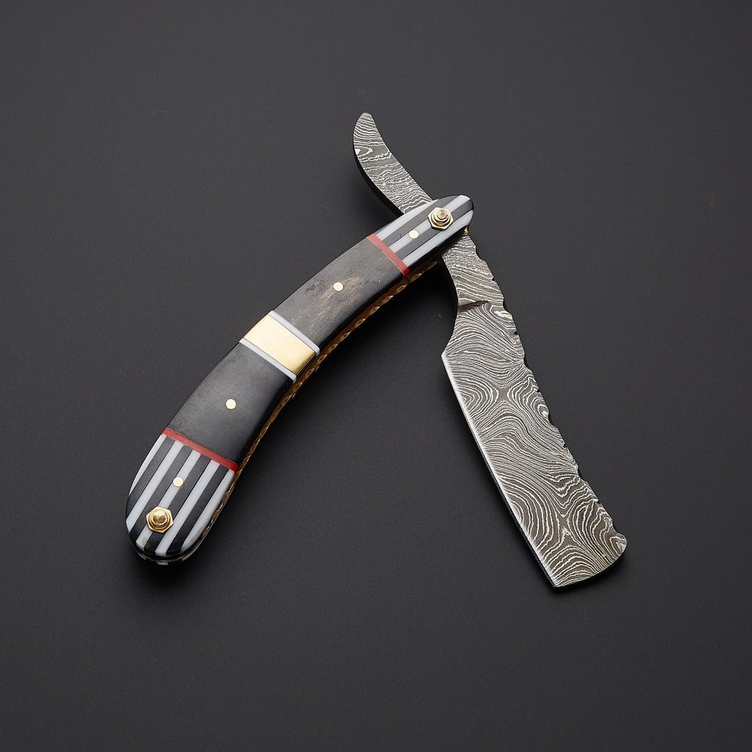 Luxury artisan straight edge razor made of Damascus steel paired with premium leather sheath for safe storage and grooming use.
