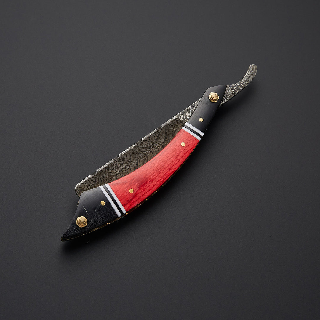 Open and folded view of custom straight edge razor showing folding mechanism and handcrafted metal detailing.